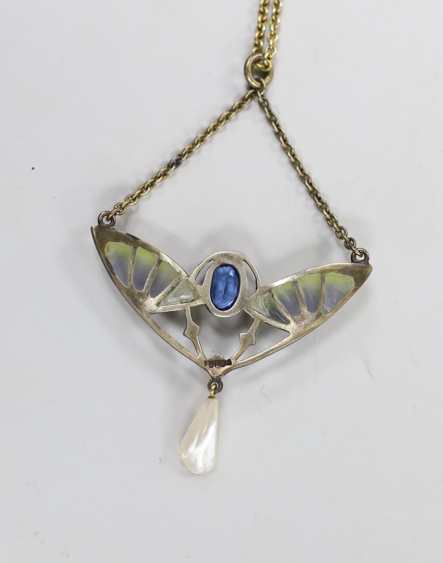 An early 20th century 800 gilt white metal, blue paste, plique a jour and freshwater pearl set drop pendant, width 41mm, on a 925 chain 47cm.